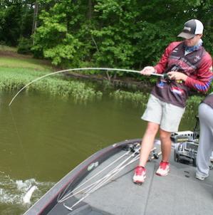 Patrick Walters fights a largemouth to the boat. Photo by Pat Robertson