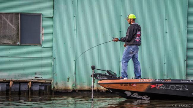 Zack Birge loads up for a cast around a dock.